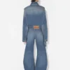 De blå denimjeansene med stropp De blå denimjeansene med stropp