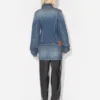 Den blå denimjakken med oversized ermer Den blå denimjakken med oversized ermer